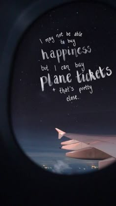 an airplane wing with the words happiness but i can buy plane tickets and that's pretty close