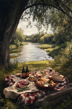 a picnic table with food and drinks on it next to a river