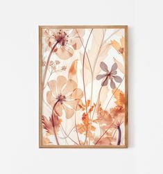 an abstract floral painting hangs on the wall in front of a white wall with a wooden frame