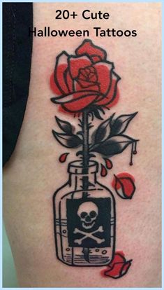 a tattoo with a skull and rose on the back of it's shoulder, which reads