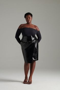 Woman wearing high gloss patent vegan leather skirt and an off the shoulder bodysuit. Plus size clothing Dress Pant, Chic Woman, Asymmetric Hem, Wrap Skirt, The Chic, British Indian, Patent Leather, Elegant Dresses, Leather Skirt