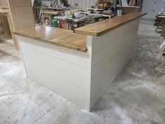 a workbench in a garage with tools on the counter