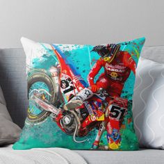 a painting of a person riding a motorcycle on a blue and green background throw pillow