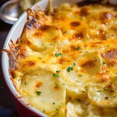 a casserole dish with potatoes and cheese