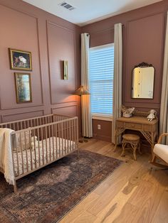 a baby's crib in the corner of a room