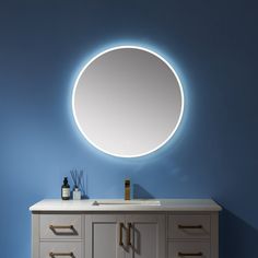 a bathroom vanity with a round mirror above it