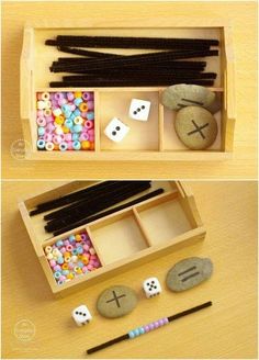 an open box filled with rocks and beads next to other items on a wooden table