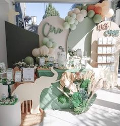 a table topped with lots of green and white decorations