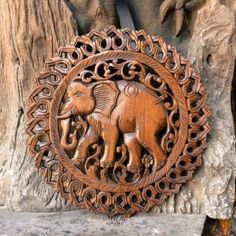 an elephant carved into the side of a tree