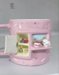 a pink coffee mug with an ice cream dispenser inside