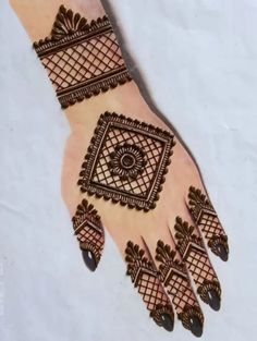 the hand is decorated with intricate designs