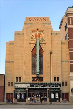 a large building with a tall cross on it's side