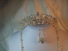 Handmade swarovski wedding tiara Adrienne set on a silver band also available in gold roughly 1 1/2 " tall ,this tiara is made using a mixture of ⁰ swarovski and presiosa crystals and pearls  clear pear and navette swarovski diamante stones ivory/white presiosa  pearls ,a stunning tiara  lots of sparkle and , also,shown in the pictures with the matching jewellery also available in my shop . Elegant Crystal Crown For Wedding, White Crown Design Jewelry For Wedding, White Crown Jewelry For Wedding, Elegant Gold Wedding Crown, White Wedding Crown With Pinched Shape, White Pinched Crown For Wedding, Silver Crystal Wedding Crown, Elegant Gold Crown With Rhinestones, Matching Jewellery