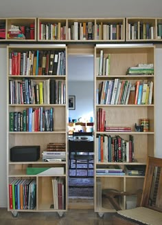 an open bookcase with many books on it