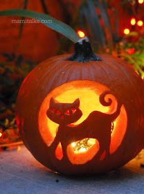 a carved pumpkin with a cat on it