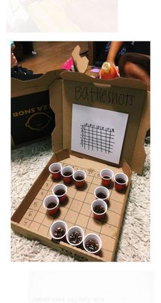 an open box with some cups on top of it and the words bottleshots written in