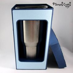 an empty blue box with a silver cup inside