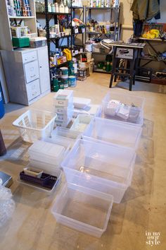 several plastic containers are stacked on top of each other in the middle of a workbench