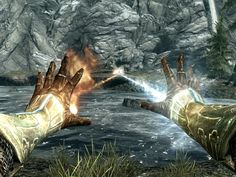 two hands reaching out towards each other in front of a river and mountains with rocks