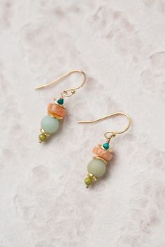 The Surrender Collection is soft and captivating. These simple stacked earrings have a lovely colorway and are ideal for pairing with other items from the collection. Gold Filled (nickel and lead-safe) Peach Moonstone, Olive Jade 1", with gold filled ear wires We hand select our natural materials, thus there may be slight variations in color and/or size that will not detract from the overall aesthetic Our unique handcrafted designer jewelry for women is made in America, each design created individually in our personal design studio in Floyd VA USA Making Jewelry Aesthetic, Beaded Jewelry Aesthetic, Simple Bead Earrings, Floyd Va, Peach Jewelry, Beach Jewelry Boho, Popular Earrings, Designer Handmade Jewellery, Stacked Earrings