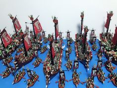 a large collection of miniature warhammers on display