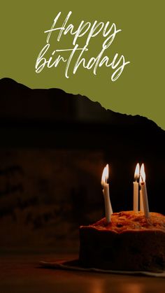 three lit candles on top of a cake with the words happy birthday written in white