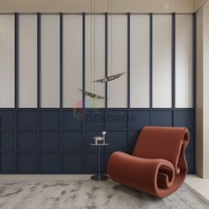 an orange chair sitting in front of a wall clock