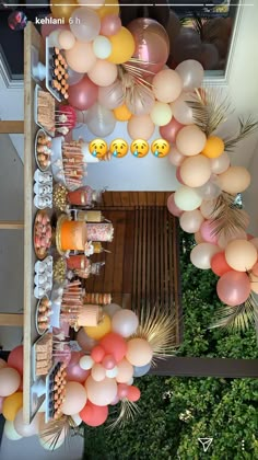 an overhead view of balloons and desserts on display