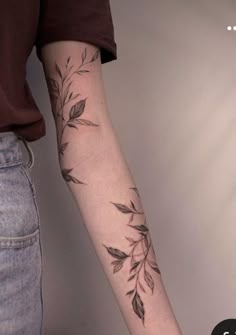 a woman with a tattoo on her arm