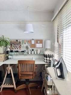 a desk with two chairs and a computer on it