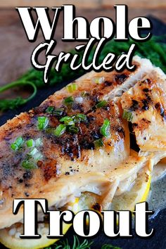 grilled fish on a black plate with text overlay that reads whole grilled trout