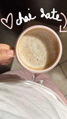 a person holding a coffee cup with the words i love you state written on it