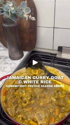 jamaican curry goat and white rice stew on the stove