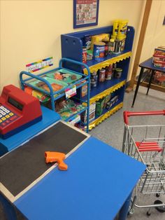 there is a toy store with toys on the tables and in front of it are shopping carts