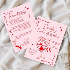 two pink cards with red ink on them