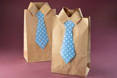 two brown paper bags with blue and white polka dots, one has a tie on it