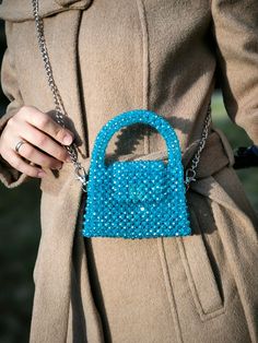 This hand-knitted children's bag stands out with its elegant shades of blue and unique craftsmanship. Each detail of this bag is meticulously crafted, resembling a small piece of art. The bright blue crystal accents create a playful sparkle on the bag, while the knitted texture adds warmth and character. Designed for children, this bag combines style and practicality. Its spacious interior allows for easy organization of daily essentials, while its sturdy knitted structure ensures long-lasting u Trendy Blue Shoulder Bag For Gift, Blue Satchel Shoulder Bag For Party, Blue Handmade Evening Bag For Everyday Use, Trendy Light Blue Bag For Gift, Blue Crochet Bag With Top Handle For Everyday Use, Blue Crossbody Bag As Gift, Blue Mobile Phone Bag For Fashion Accessory, Blue Crossbody Evening Bag As Gift, Blue Crossbody Evening Bag For Gifts