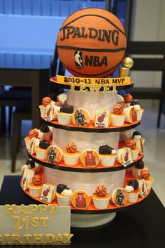 a basketball themed cake with cupcakes on top