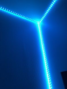 a room with blue walls and lights on the wall