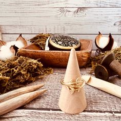 several different types of items on a table with wood shavings and cotton swabs