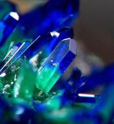 some very pretty blue and green crystals on top of each other in close up view