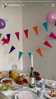 an image of a table with food and balloons