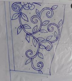 a piece of paper that has been drawn with blue ink and some leaves on it