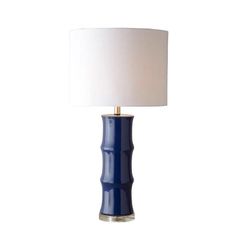 a blue table lamp with a white shade