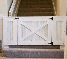 an open door on the side of a staircase leading up to a set of stairs