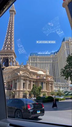 the eiffel tower seen through a car window