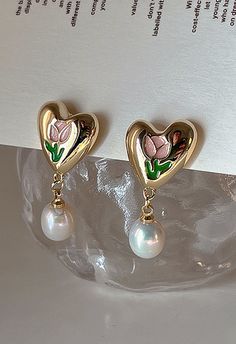 - Heart shape - Tulip pattern - Pearl embellished - Material: 100% Alloy - Pearl: 100% Plastic Rose Drop Earrings, Regal Earrings, Tulip Jewelry, Tulip Pattern, Pretty Accessories, Dope Jewelry, Heart Shaped Earrings, Gold Pearl Earrings, Classy Jewelry