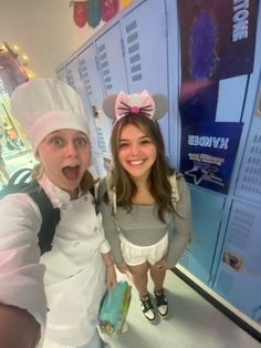 two girls in costumes posing for the camera