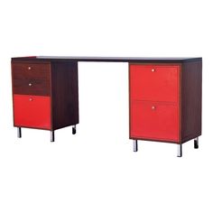 a red and brown desk with two drawers on each side, against a white background