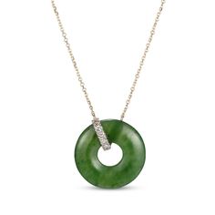 Traditional with a modern element, this nephrite jade and diamond necklace is a wondrous addition to her repertoire. Crafted in 14K yellow gold The pendant features a donut-shaped nephrite jade suspended in a jaunty loop of round-cut diamonds Total diamond weight is 1/15 carat The pendant suspends centered along an adjustable 18-inch cable chain that secures with a spring ring clasp Donut Necklace, Jade Charm, Donut Shape, Gems Art, Nephrite Jade, Jade Necklace, Jade Ring, Jade Pendant, Accessories Jewelry Necklace